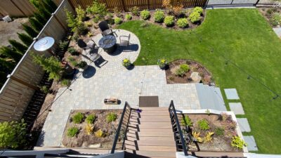 New hardscaping connects the deck with the outdoor fire circle, the garage and the sideyard