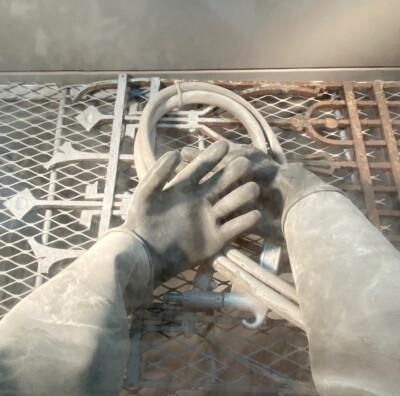 Learning a new skill - Bead blasting the final layers of paint to expose the raw wrought iron surface