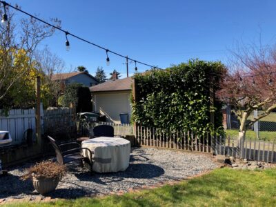 The homeowners had been busy remodeling their home since purchasing and although they enjoyed outdoor entertaining in the back yard it lacked a level area for seating and was lacking defined areas for planting beds, a cutting garden and for growing edibles