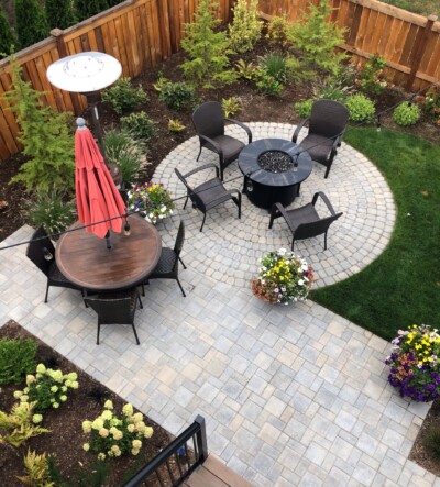 A fire circle embraced by Mountain Hemlock trees and a lush, sloped lawn create an intimate setting for gatherings with friends.
Photo Courtesy of Client A fire circle embraced by Mountain Hemlock trees and a lush, sloped lawn create an intimate setting for gatherings with friends